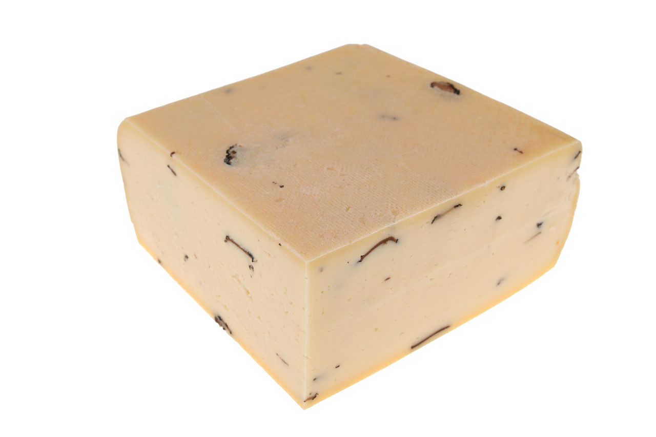 Cremiger Schweizer Rohmilchkäse mit edlem Trüffel verfeinert – ideal zum Schmelzen, erhältlich bei kaeseversand24.de